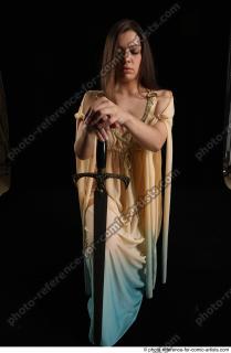 BARBORA KNEELING POSES WITH SWORD